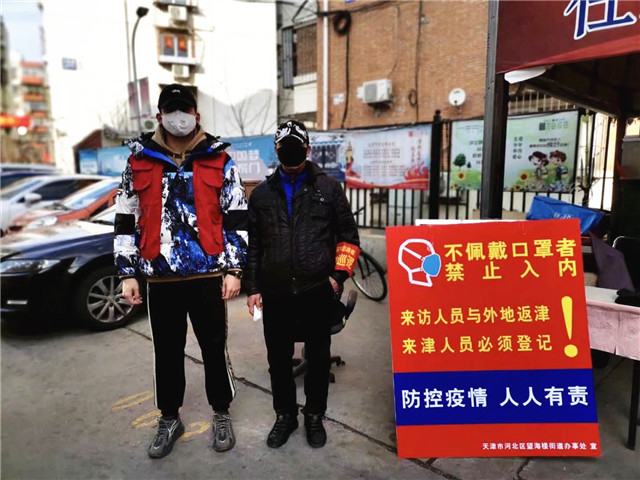 信院学子变身防疫志愿者 志愿精神汇聚战“疫”力量